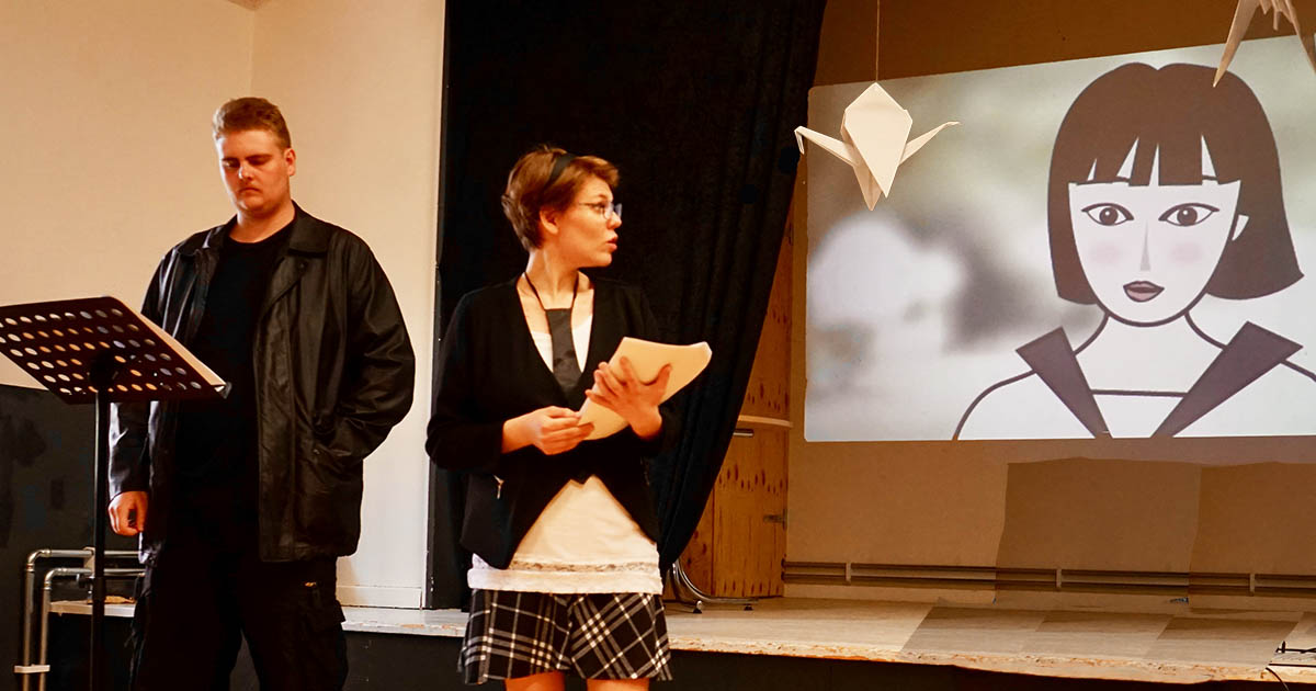 Learning through theatre on stage. Performing on stage is the final product.